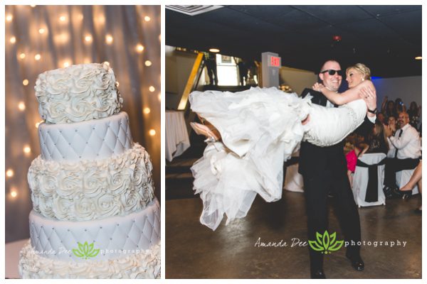 wedding cake and groom carrying bride into reception