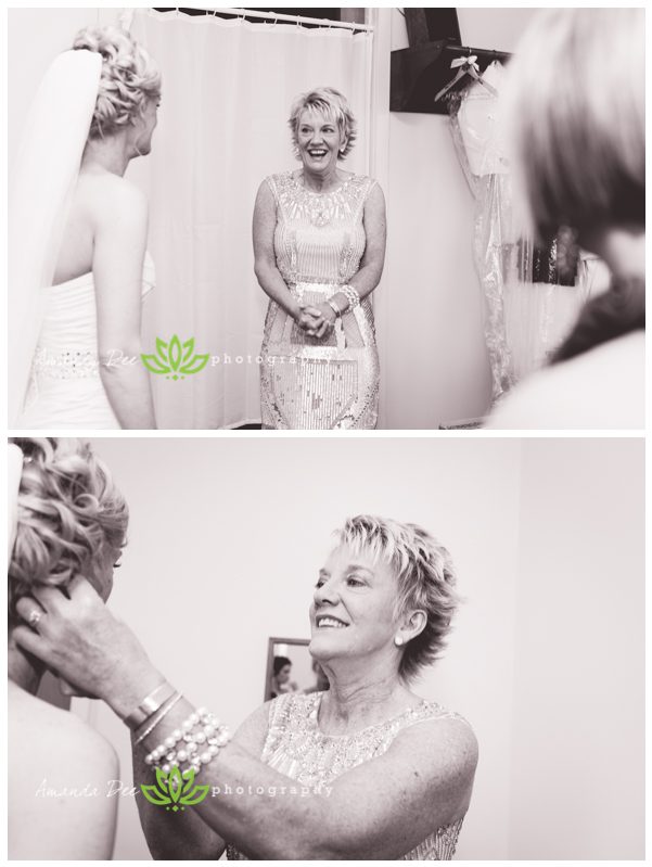 Wedding photos of bride getting ready with mother seeing her for the first time