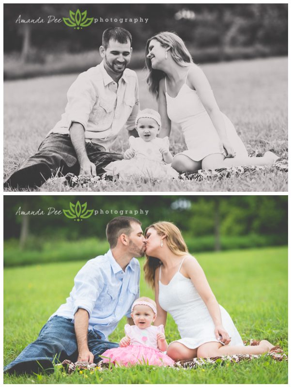 Outdoor Family photo sitting on blanket with baby kissing in background