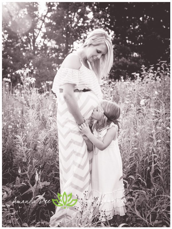 Outdoor Summer Maternity and Family Session Amanda Dee Photography daughter kissing belly black and white