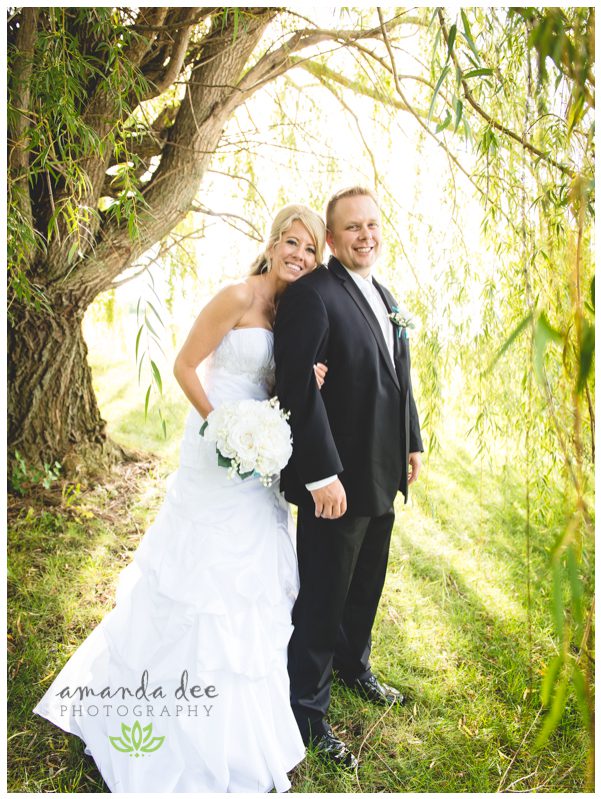 Summer Wedding Teal Accents - Amanda Dee Photography -Bride and Groom under willow tree